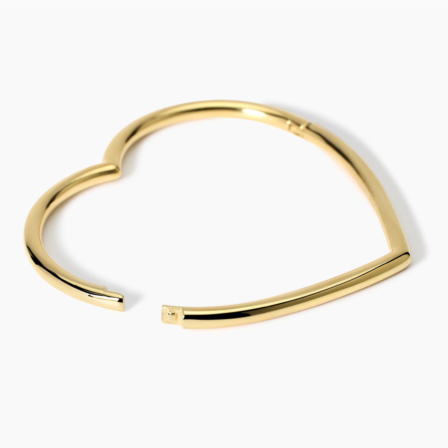 Bracciale rigido a cuore in acciaio dorato